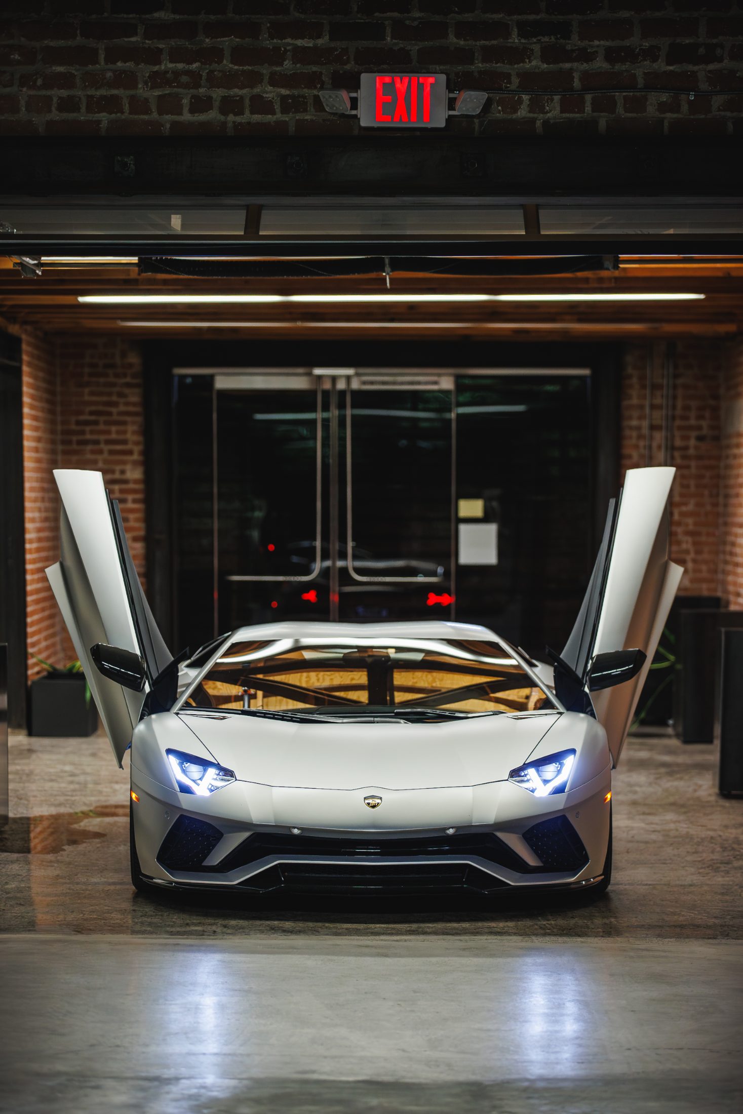 Car with doors up on the warehouse floor